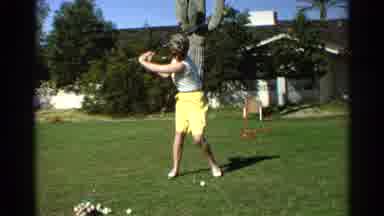 Scottsdale Arizona (1968): Men In Front Of Red Chair Swinging In Golf Move