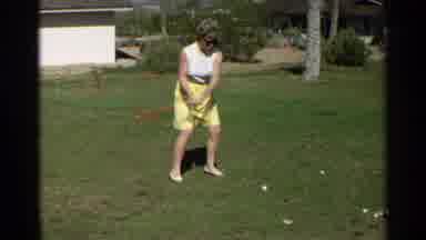 Scottsdale Arizona (1968): A Lady In A White Blouse And Yellow Skirt Swinging A