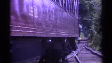 Chicago Illinois (1976): Trolley Passing By Person Walking On Tracks Behind