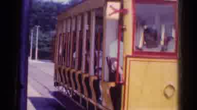 Chicago Illinois (1976): People Riding In Red And Yellow Trolley Car On A Sunny