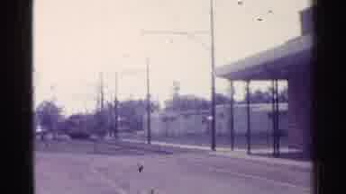 Chicago Illinois (1976): Very Old Street Running Train Approaching A Man Waiting