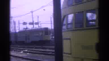 Chicago Illinois (1976): Yellow Trolley Car Traveling On Tracks Rounding A Corner