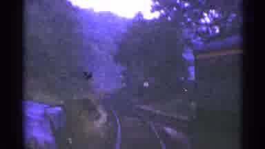 Connecticut USA (1953): Train On The Tracks Passing Through Town With Hills And