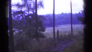 Connecticut USA (1953): Train Moving Along Tracks Towards Hills