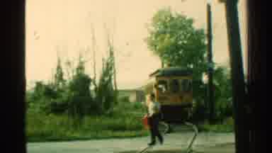 Connecticut USA (1953): Approaching Yellow Electric Train On A Clear Day