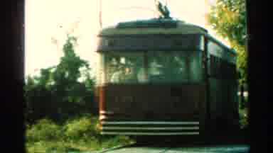 Connecticut USA (1953): Brown Trolley Train Car Rolling On Tracks On A Bright