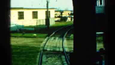 Connecticut USA (1953): A Train Engine Moves Near And In between Lot Of Houses
