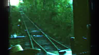 Connecticut USA (1953): A Man Manually Pulls A Train Switch For A Train Traveling