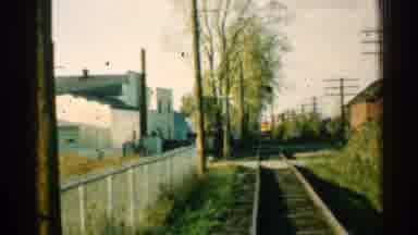Connecticut USA (1953): Looking Down An Old Railroad Track By A Fence In Town