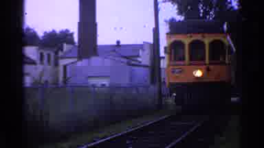 Connecticut USA (1953): Yellow And Orange Train Heads Down Track Towards Camera