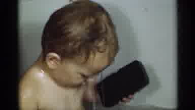 Michigan USA (1939): Baby In The Bathtub Playing Lady Puts Water On His Head Then