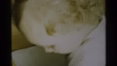 Michigan USA (1939): Young Child Trying To Stand In Crib And A Glimpse At An Old
