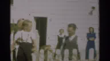 New Orleans Lousiana (1949): Woman Wearing Blue Dress Standing Next To A White