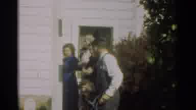 New Orleans Lousiana (1949): A Family Stands Outside A House Door While A Girl