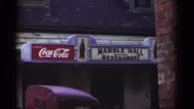 New Orleans Lousiana (1949): Coca Cola Sign Next To Yellow Market Sign On A Clear