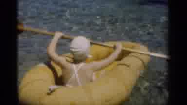 New Orleans Lousiana (1949): Young Girl Rowing A Raft With A Dog In The Water