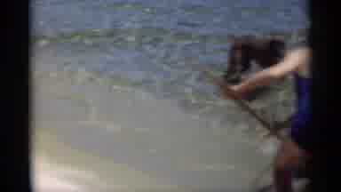 New Orleans Lousiana (1949): A Young Girl In A Swimsuit Plays At The Beach With