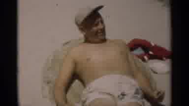 New Orleans Lousiana (1949): Man Sitting On A Beach And Child Sits Next To Him