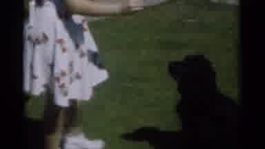 New Orleans Lousiana (1949): A Child Trains A Dog To Sit On Its Hind Legs Using A