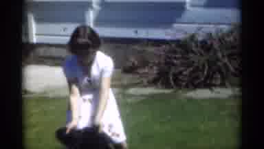 New Orleans Lousiana (1949): Young Girl Playing With Dog In Yard Outside Next To