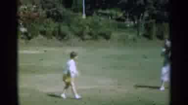 Santa Cruz California (1949): A Child And A Lady Playing Ball On The Field