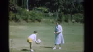 Santa Cruz California (1949): A Women Playing With A Girl With A Ball And Another