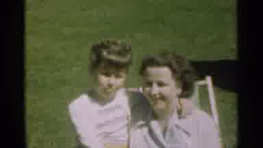 Santa Cruz California (1949): A Girl With Her Arm Around A Female Adult Are
