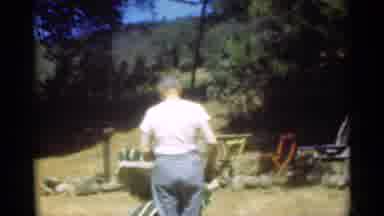 Santa Cruz California (1949): A Man Looking At The Camera Then Fixes The Top Of A