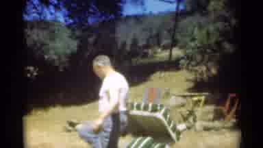 Santa Cruz California (1949): Man Wearing White Shirt Sits In Green Lawn Chair On