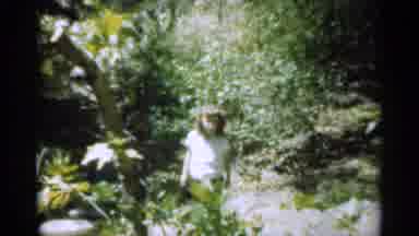 Santa Cruz California (1949): Little Girl Poses By A Short Topped Tree Surrounded