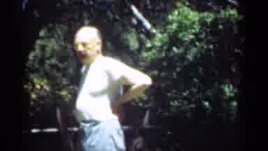 Santa Cruz California (1949): A Man Standing With His Hands On His Hips Appearing
