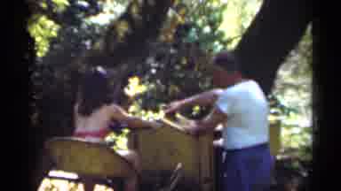 Santa Cruz California (1949): A Dad And Daughter Playing With A Toy Train Together
