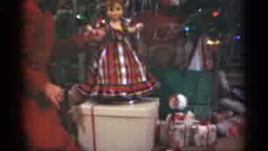 Santa Cruz California (1949): Girl In Red Dress Plays With Doll Under Christmas
