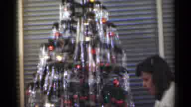 Santa Cruz California (1949): Young Girl Showing Off Doll In Front Of A Decorated
