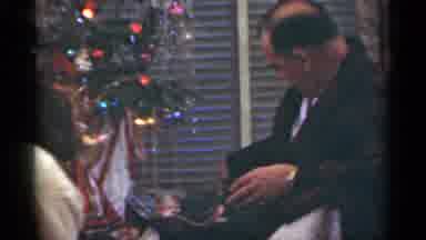 Santa Cruz California (1949): Father Opens Christmas Gift