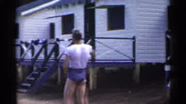 New York USA (1954): Man Plays Catch With Children As Other People Go To The Dock