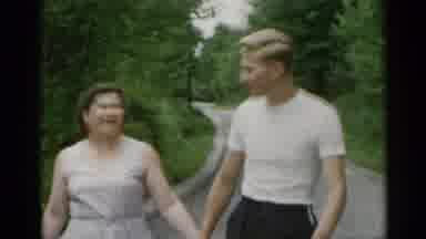 New York USA (1954): A Men Taking A Walk To The Park With His Wife And Talking To