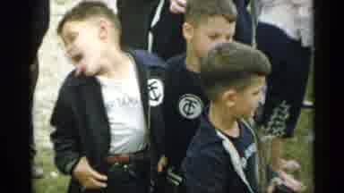 New York USA (1954): Three Little Boys Hanging Around Each Other With One Making A