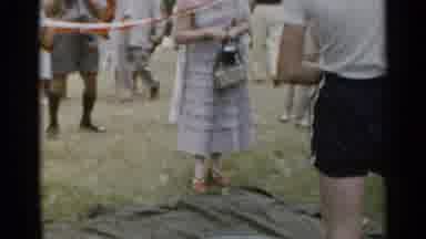 New York USA (1954): Woman Tossing Items Towards Bucket Cut To Child Bobbing For