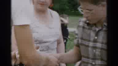 New York USA (1954): Serving Hot Dogs At A Barbecue