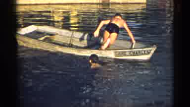 New York USA (1954): Two Men Hanging Out In A Boat On A Lake