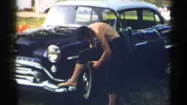 New York USA (1954): A Couple Brothers Hanging Out Together Working On An Old Car