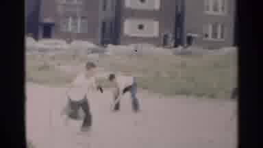 New York USA (1954): Some Boys Each Playing Together Outside On A Nice Summer Day