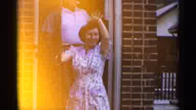 New York USA (1954): House Door Bricks Home Family Man Women Middle Aged Dress