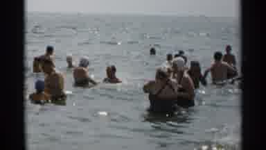 New York USA (1954): Old And Young People Having Fun And Swimming In Clear Sea