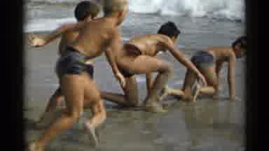 New York USA (1954): Young Boys Playing In The Ocean Surf At The Beach Sand Waves