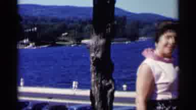 Lake George New York (1955): A Woman Stands Beside A Metal Railing Overlooking A
