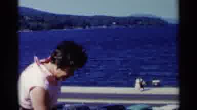 Lake George New York (1955): Person Wearing White Walking On Bridge Crossing Lake