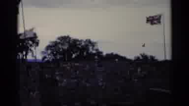 Lake George New York (1955): Garden With Grey Stone Walls And Three Flags With