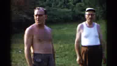 Lake George New York (1955): Woman In Black Shorts Standing By Two Men One